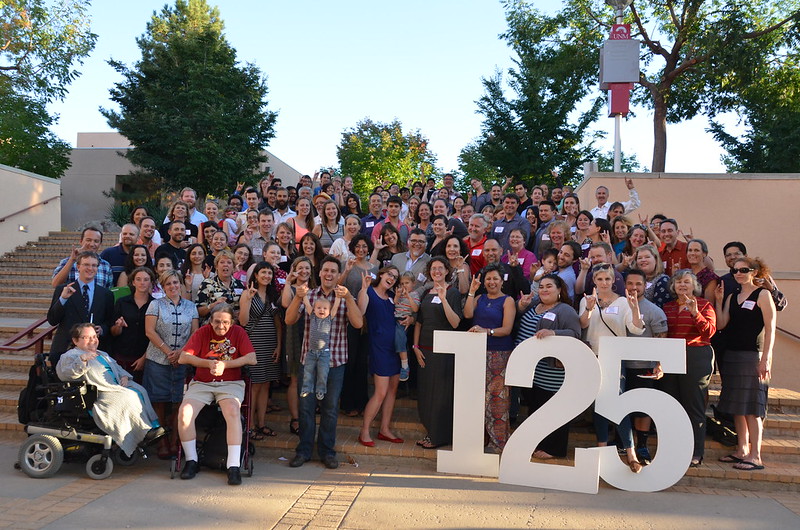 many students posing on steps with large 125 numbers